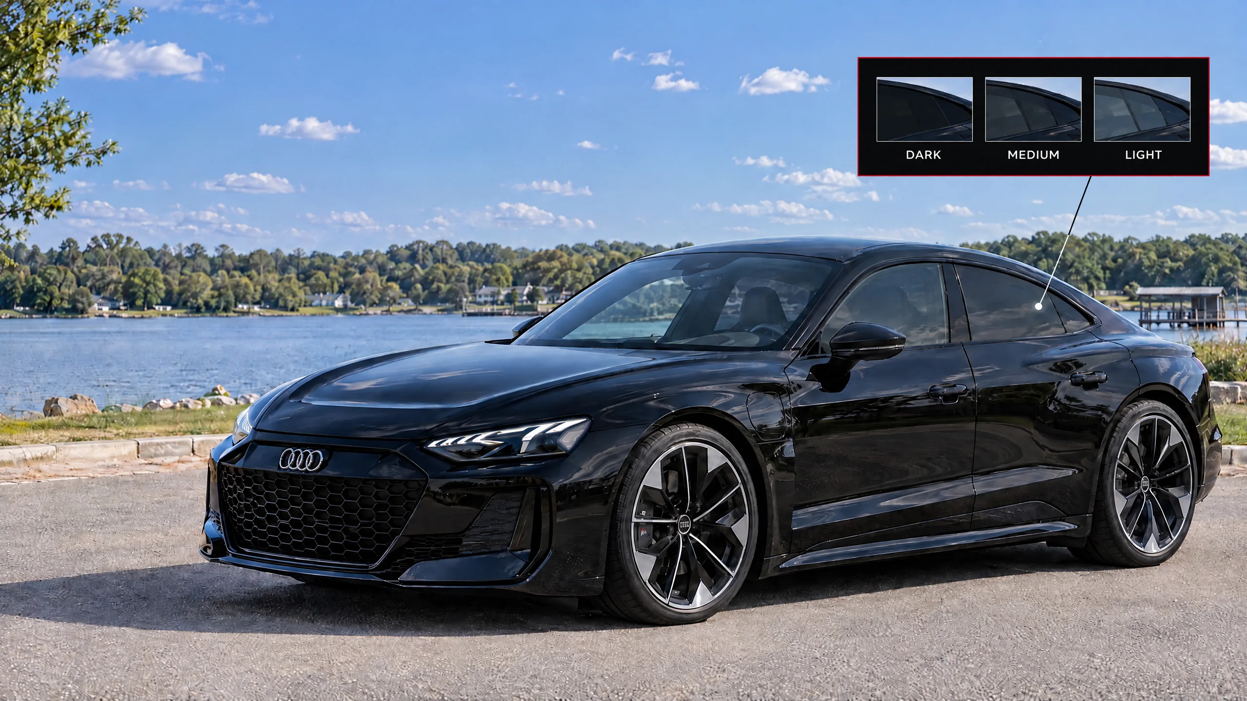 A black Audi RS e-tron GT by an Alabama lake on a sunny morning, with a light, medium and dark window tint preview